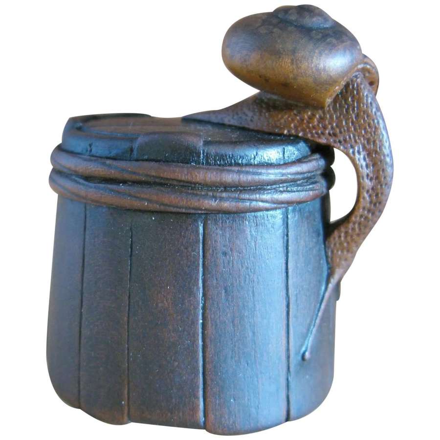 Shigemasa (重正) wood netsuke snail on bucket